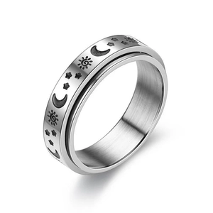 Silver stainless steel spinner ring with engraved sun, moon, and star celestial motifs