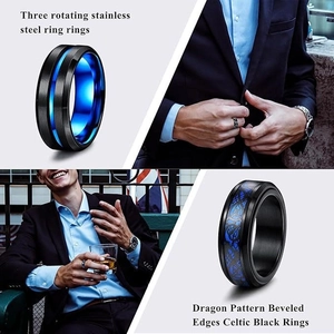 Two-tone black stainless steel rotating rings with blue Celtic dragon and beveled edges