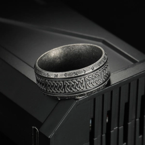 Vintage silver Viking ring with Celtic knot reliefs and Nordic runes on a matte band