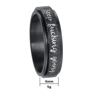 6mm black titanium spinner ring with keep fucking young engraving and sandblast finish