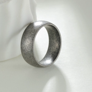 Vintage spherical wide band ring with a distressed silver finish and matte stone texture