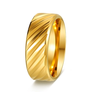 Macro detail of men's wide gold ring featuring textured diagonal stripes and polished finish