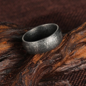 Vintage roman numeral titanium steel ring with aged silver finish on dark wood