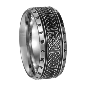 Macro detail of vintage Viking rune ring with celtic knot engraving in aged silver steel