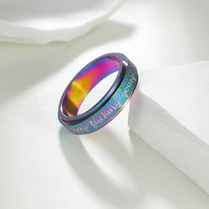 Rotating stainless steel spinner ring with rainbow plating and keep fucking going engraving