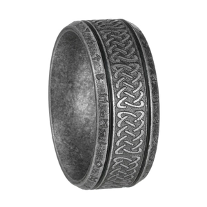 Detail view of vintage Viking ring showing Celtic knots and carved Runic characters