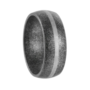 Macro shot of industrial titanium steel ring with textured surface and silver inner band