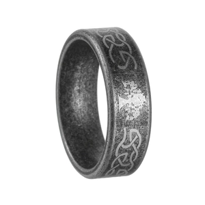 Macro shot of vintage tree of life engraving on a retro stainless steel ring band