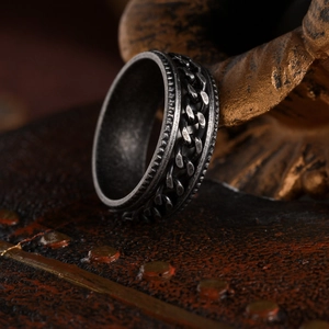 Retro distressed stainless steel spinner ring with chain texture and engraved edges
