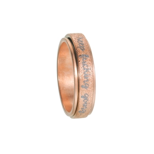 Detail of rose gold spinner ring with sandblasted finish and engraved motivational quote