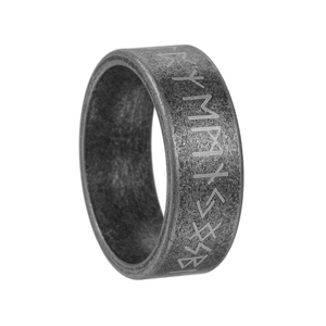 Detail of vintage Nordic Futhark runes engraved on an oxidized silver titanium steel ring