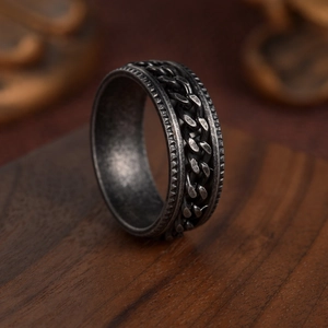 Vintage oxidized silver spinning chain ring for men with punk industrial style engraving