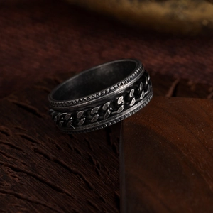 Vintage oxidized silver spinner ring for men with rotating Cuban chain and industrial finish