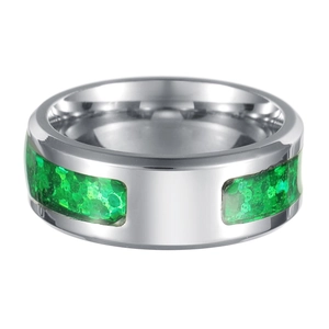 Macro shot of silver wide band ring with inlaid crushed green synthetic opal textures