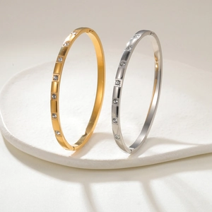 Minimalist 18K gold and silver stainless steel bangles with 4mm cubic zirconia inlay