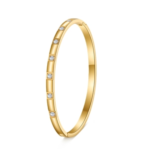 Detail view of 18K gold plated stainless steel bangle with inlaid zircons and hinge