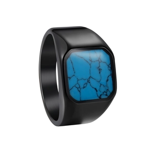 Macro shot of men's black stainless steel signet ring with blue turquoise inlay and brushed finish
