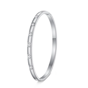 Detailed view of silver stainless steel bangle with eight square-set zircon stones