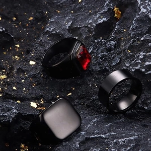 Three-piece men's matte black titanium steel ring set featuring a red ruby stone inlay