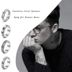 Spinner rings for stress relief with sun moon celestial and braided textures in steel