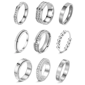 Detailed grid showing silver titanium rings with frosted, polished, and paved diamond styles