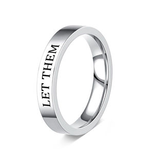 Close-up of polished stainless steel ring featuring engraved LET THEM inspirational text