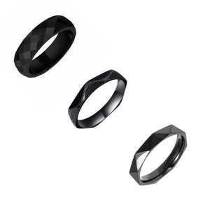 Three-piece black titanium steel ring set featuring faceted and textured geometric designs