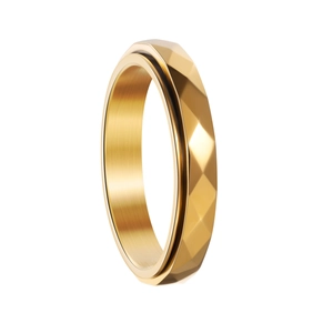 Macro detail of golden spinning ring with geometric rhombus facets and brushed inner band