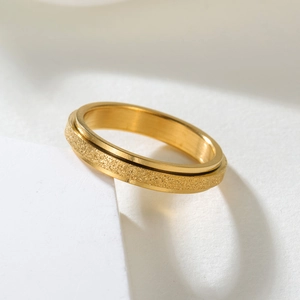 Titanium steel spinner ring with golden frosted finish and smooth inner band