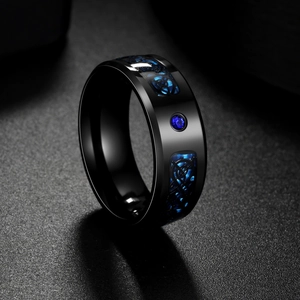 Black titanium ring with blue carbon fiber, dragon celtic pattern and blue zircon