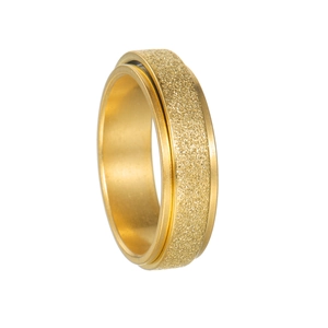 Close-up of golden spinner ring with frosted sandblasted texture and polished inner surface