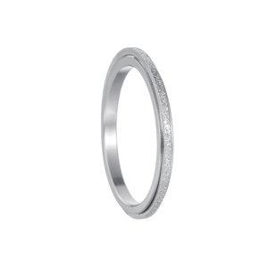 Detailed macro view of silver spinner ring with matte sandblasted surface and polished inner edge
