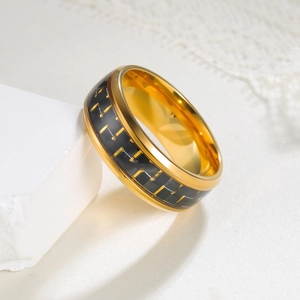 Detailed side view of 8mm black titanium ring with yellow checkered carbon fiber inlay