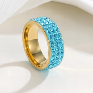 Titanium steel ring with three rows of light blue crystals and gold-plated finish