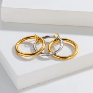 Stackable minimalist gold and silver titanium steel rings set with three zircon stones
