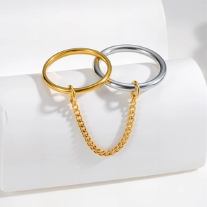 Minimalist chain linked double ring set in gold and silver finish on white background