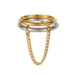 Detailed view of 3-in-1 layered rings in gold and silver with connecting chain link