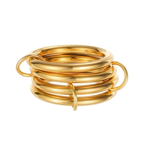 Detailed macro view of 18K gold plated multi-layer stacked rings with a mirror finish