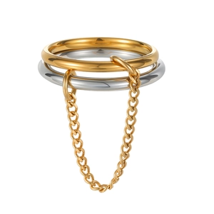 Three-ring stackable set in gold and silver steel connected by a fine metal chain