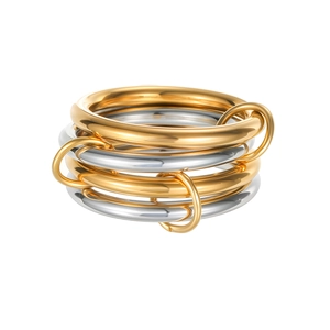 Detailed view of layered titanium steel rings with gold plating and mirror polish finish