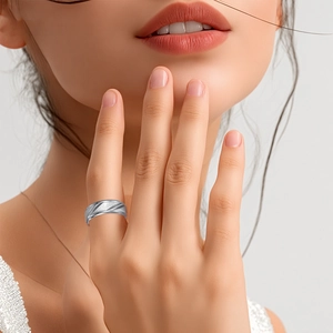 Detailed close-up of 8mm titanium steel ring with diagonal grooves and brushed finish texture