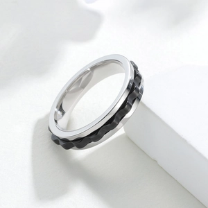 Minimalist 6mm rotatable gear stress relief ring in polished silver with black wave inlay