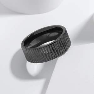 8mm black stainless steel ring with vertical textures on white geometric background