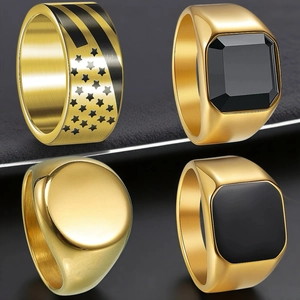 Detailed set of four men's gold stainless steel hip-hop rings with varied engraved designs