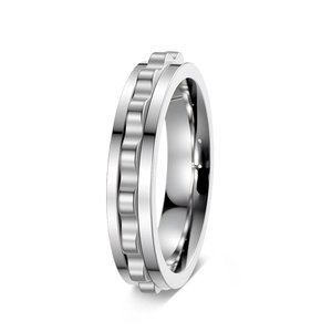 Detail view of silver stainless steel spinner ring with rotating gear mechanism