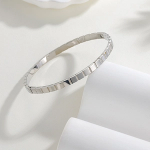 Minimalist silver 4mm stainless steel geometric bangle with square segment design