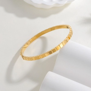 Polished 4mm gold square cube bangle in minimalist stainless steel geometric design