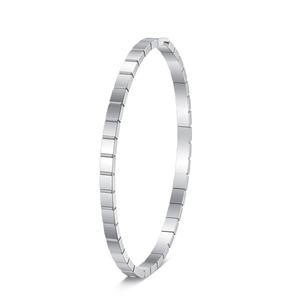 Macro shot of silver cube geometric pattern on the stainless steel bangle bracelet