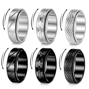 8mm spinner rings in silver and black with knurled and grooved texture patterns