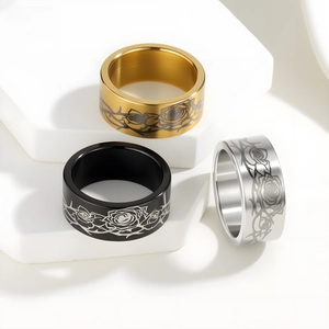 Three men's stainless steel rings in gold black and silver with rose and thorn engraving